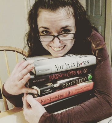 Devouring Books Mandy Hugging her books